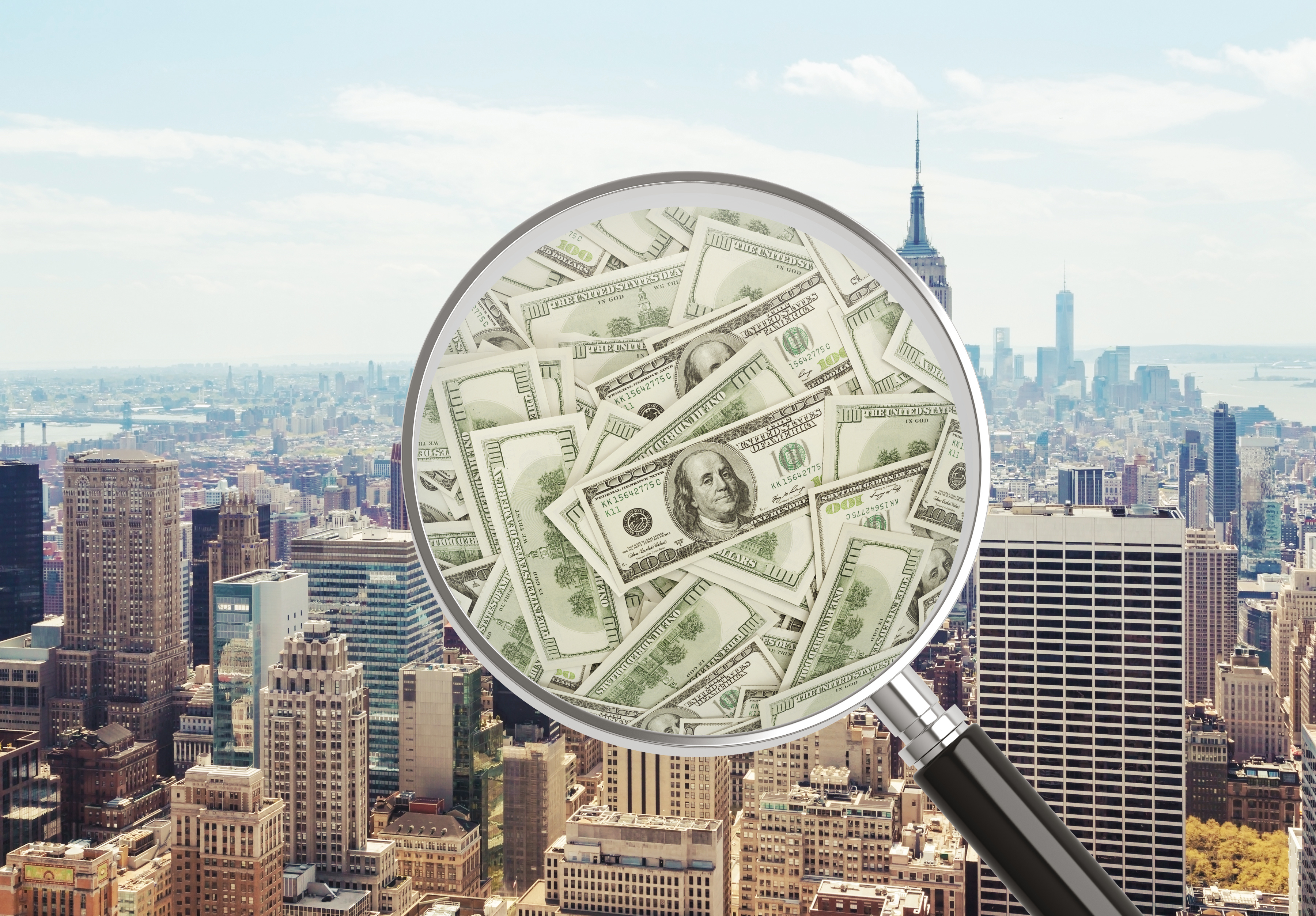 Magnifying glass searching money on New York City background