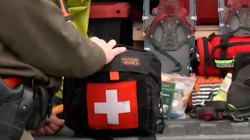 Forest Ranger Seamus Peterson shows the supplies you need to be safe while winter hiking.